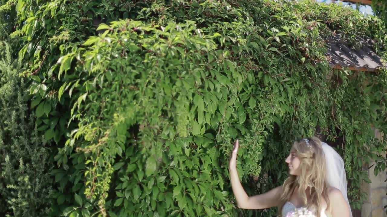 Bride Posing In Her Wedding Day. Beautiful bride in wedding day outdoors