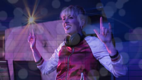 Composition-of-caucasian-femal-dj-playing-at-disco-with-sport-of-light-in-background