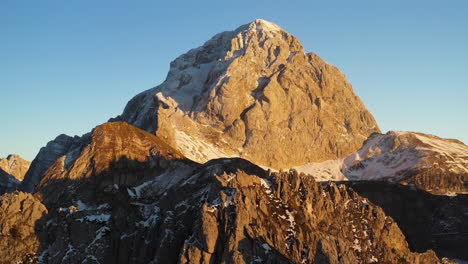 revealing drone shot of the mangart mountain in the julian alps, slovenia