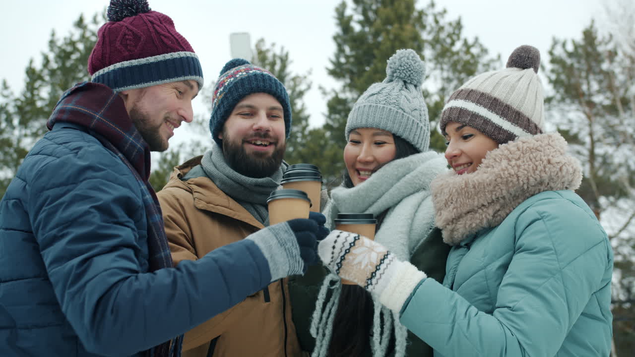 Friends Enjoying Coffee Outdoors in Winter