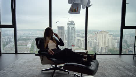 Businesswoman-reading-business-papers-in-office.-Professional-throwing-documents