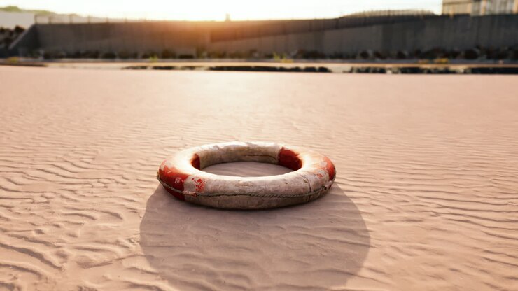Lifebuoy on the city beach at sunset