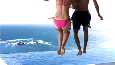 Couple-dipping-into-the-water-in-slow-motion