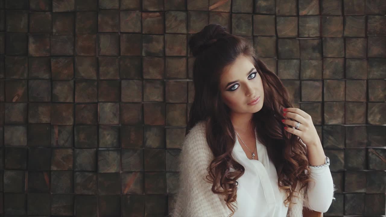 Woman with stylish makeup and hairstyle