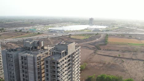 contract work of big building on major connecting highway of urban city is going on.