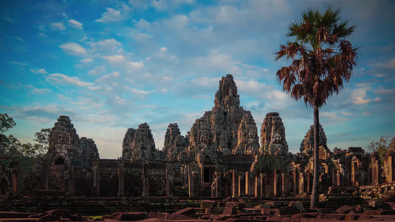 Bayon Temple smiling stone faces time lapse cinemagraph. Angkor Wat, Cambodia. Clouds moving across the sky
