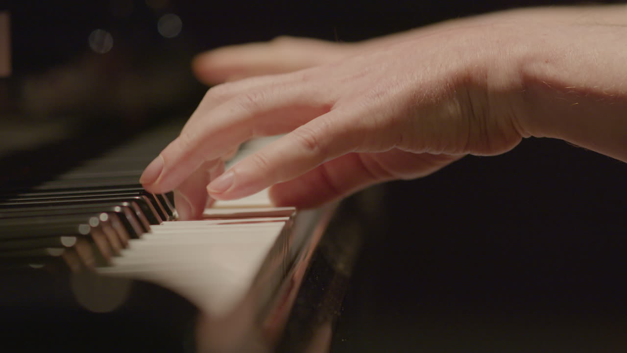 Hands of Male Pianist Playing Grand Piano