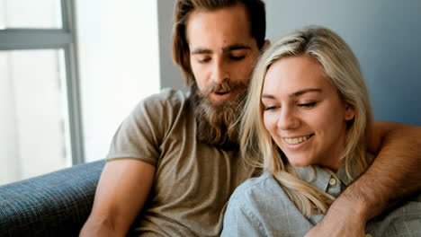couple using digital tablet in living room 4k