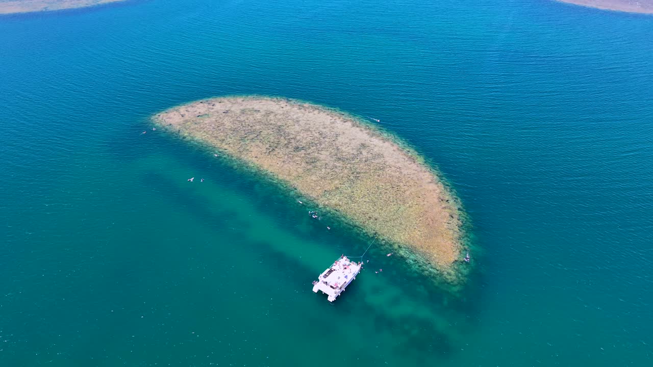Catamaran and snorkelers at Half Moon Reef in Hanauma Bay, Oahu, Aerial