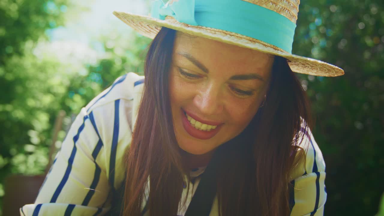 Woman gardening in a sunny garden