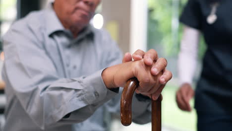 nurse supporting elderly patient