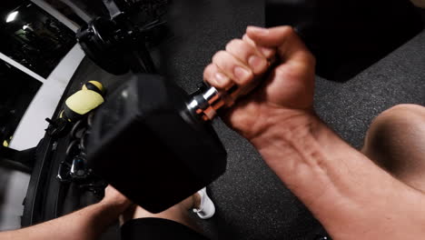 person working out with dumbbells in gym