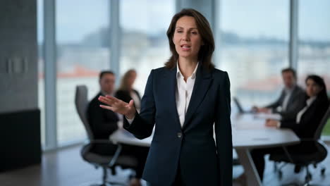businesswoman presenting in a boardroom