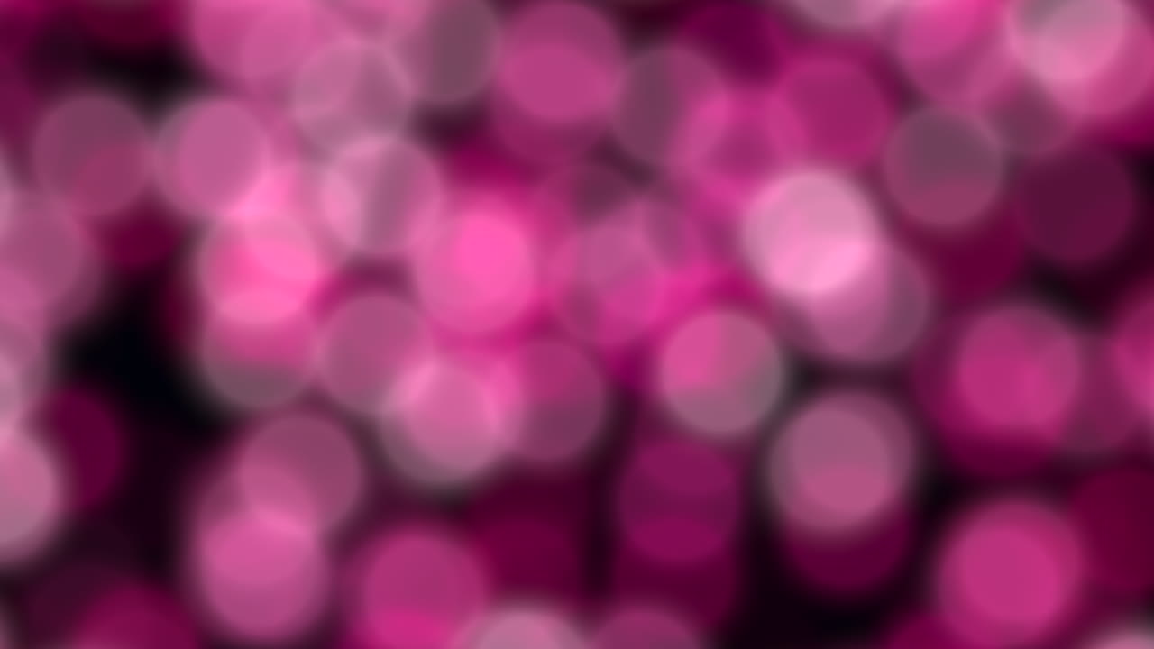 Vibrant blurred circles pink and purple on black