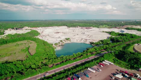 Aerial-of-Thornton-Quarry,-one-of-the-world's-largest-aggregate-quarries,-located-just-south-of-Chicago-in-Thornton,-Illinois,-showcasing-its-vast-commercial-stone-mining-operations