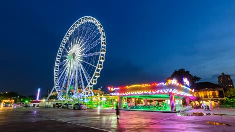 time lapse of ferris wheel in carnival park