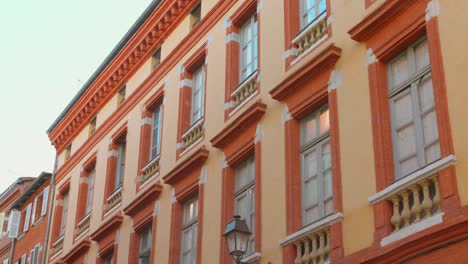 building with multiple windows in toulouse, france. - wide shot