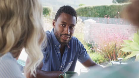 video of diverse family spending time together and having dinner outside