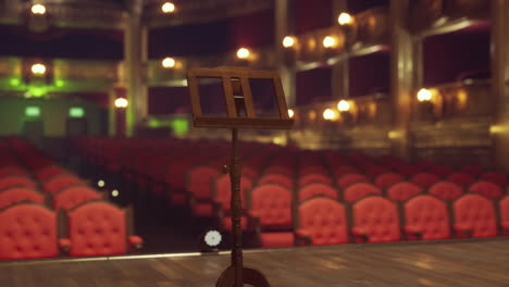 empty theater stage with music stand