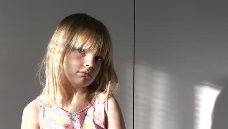 cute blond caucasian girl, looking into camera, neutral, sunbeam from window, medium shot