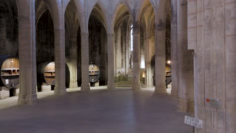 aerial orbiting shot of beautiful stone arches within a beautiful french abbey