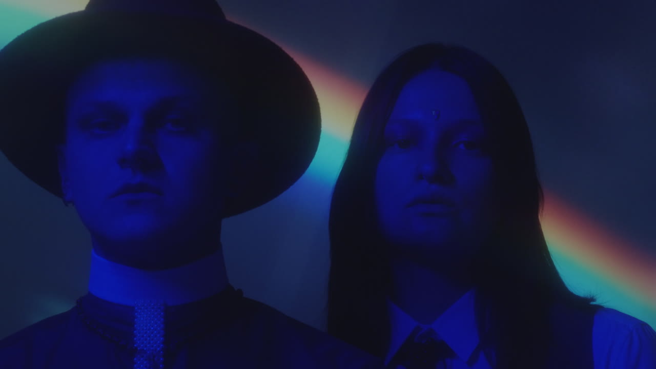 Portrait of Priest and Girl In Neon Light