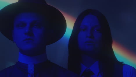 portrait of priest and girl in neon light