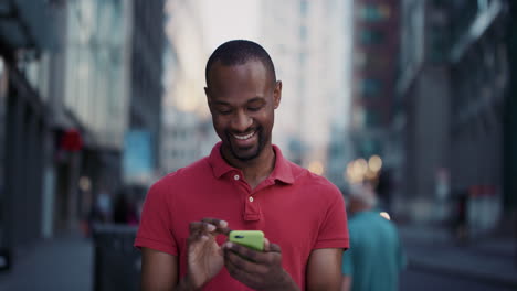Slow-Motion-Portrait-of-happy-african-american-man-using-smart-phone