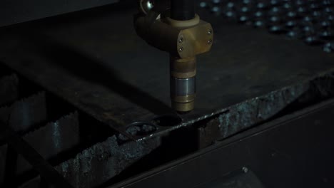 plasma cutter. plasma robotic industrial equipment works with metal sheet.