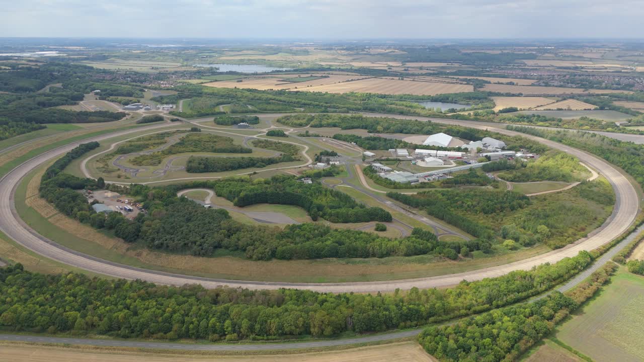 Aerial drone view of Bedford motor vehicle proving grounds England with testing track, car research innovation and automotive development in green hills