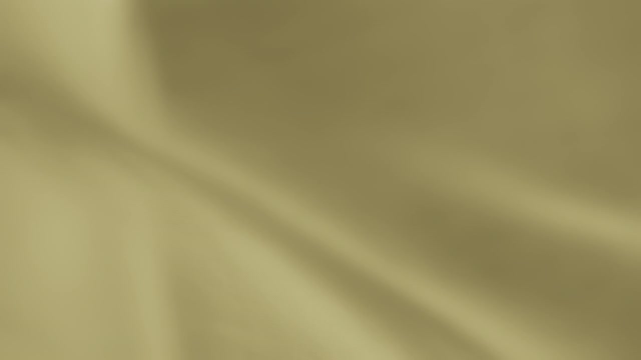 Abstract background of yellow chiffon fabric waving in the wind