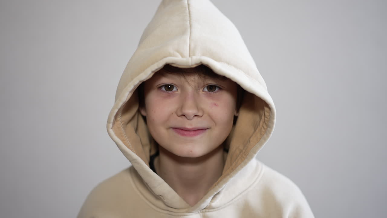 Smiling Boy in a Hoodie