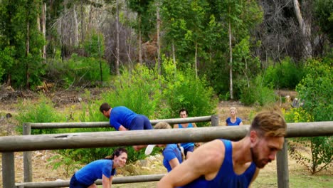 fit people jumping over the hurdles during obstacle course 4k