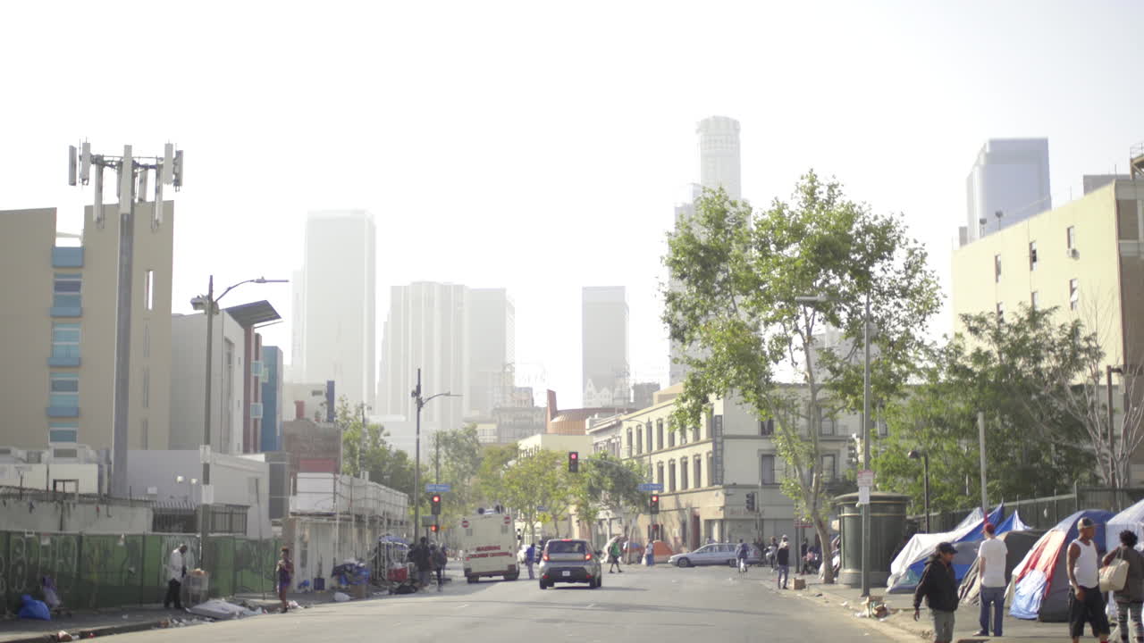 Urban Street Scene with Homeless Encampment and Downtown Skyline