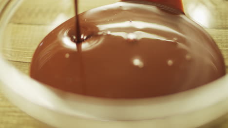 Hot-chocolate-pouring-on-glass-bowl-in-slow-motion.