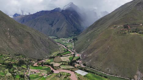 aerial drone view of ollantaytambo inca city town in peru mountains and inca ruins