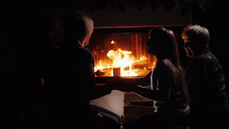 silhouettes of people playing by the fireplace