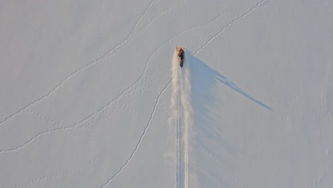 cinematic drone footage of snowmobile