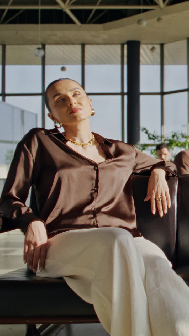 Woman Waiting in Airport/Business Lounge