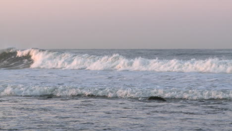 surfer catching a wave at surfers point in ventura california