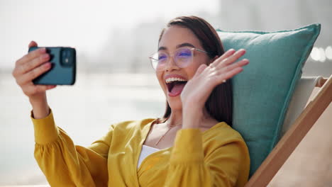 woman taking a selfie on the beach