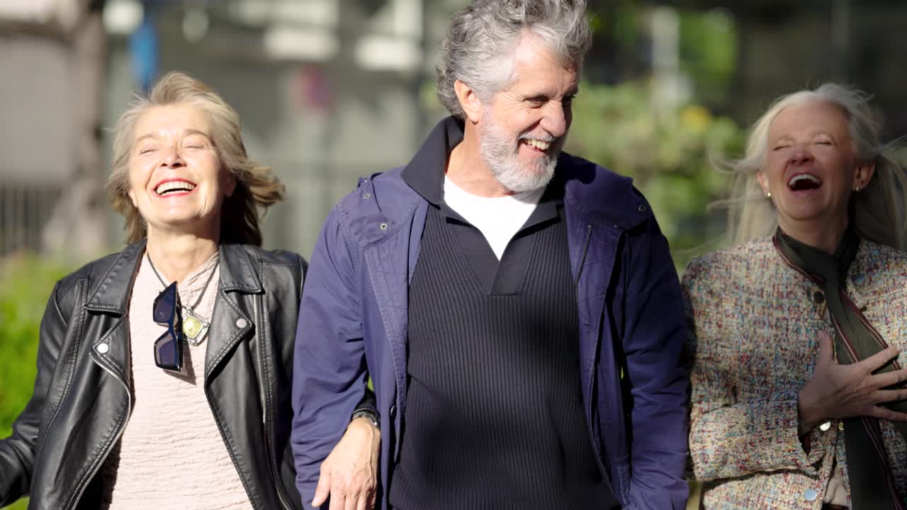 People walking on a street with luggage