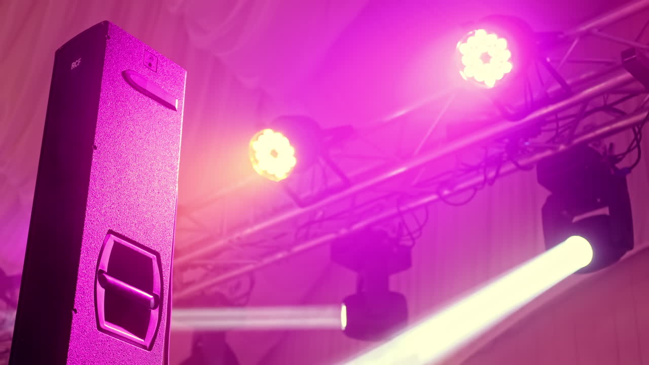 CHISINAU, MOLDOVA - AUGUST 3, 2021: Stage lights at wedding. Fog in the air