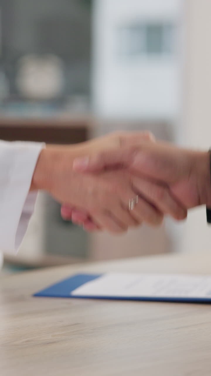 Handshake between doctor and patient