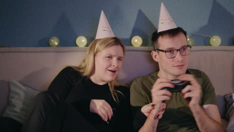 couple celebrating birthday with video games