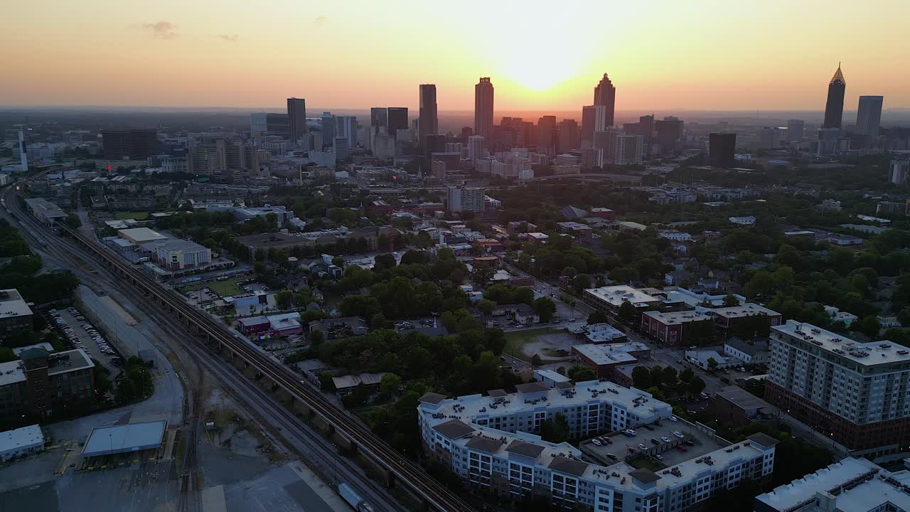Aerial view of Atlanta Georgia city skyline with golden sunset sky