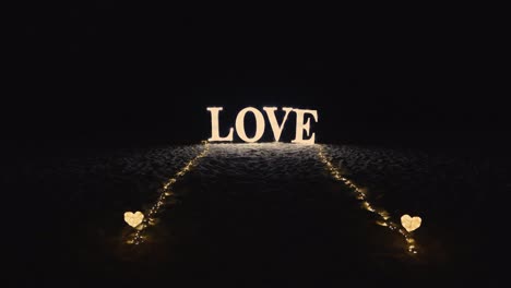 romantic illuminated letters for decorating word love on beach at night