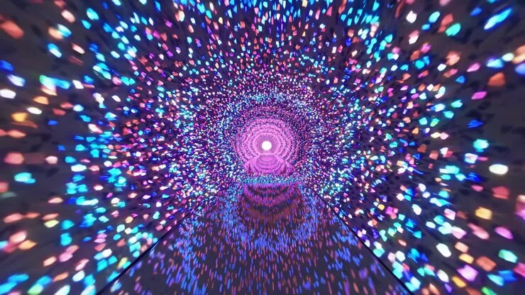 Il tunnel vibrante di luci colorate crea un'esperienza visiva ipnotica, mostrando un flusso continuo di illuminazione e profondità, che conduce verso un centro radioso.
