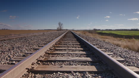 railway tracks timelapse rural - static shot looking down train tracks