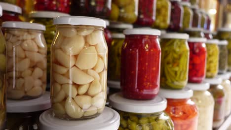 pickled garlic and vegetables in jars